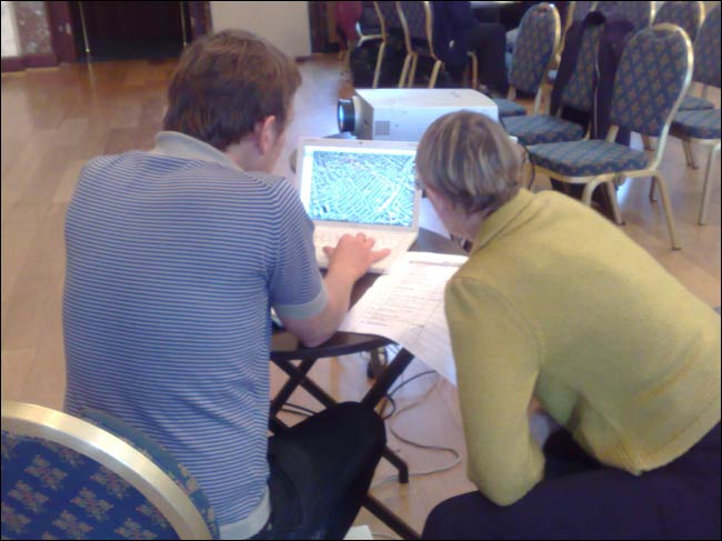 Simon Pope and a participant choosing a route