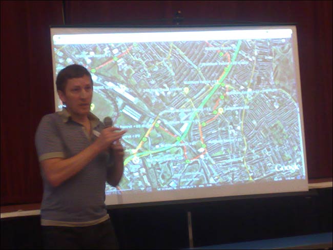 Simon Pope and the route map behind him