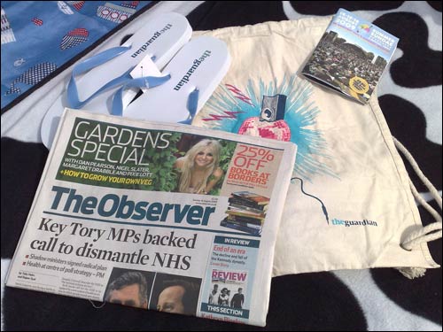 The Observer surrounded by Guardian branded freebies