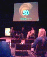 Charles Wheeler, Richard Baker and Natasha Kaplinsky await lights up at the first panel session for the BBC News 50 year celebration