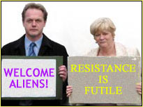 A mock-up of Ed Matts and Ann Widdecombe holding signs welcoming aliens to Warth