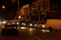 A car waits in vain to turn right - nobody lets them in