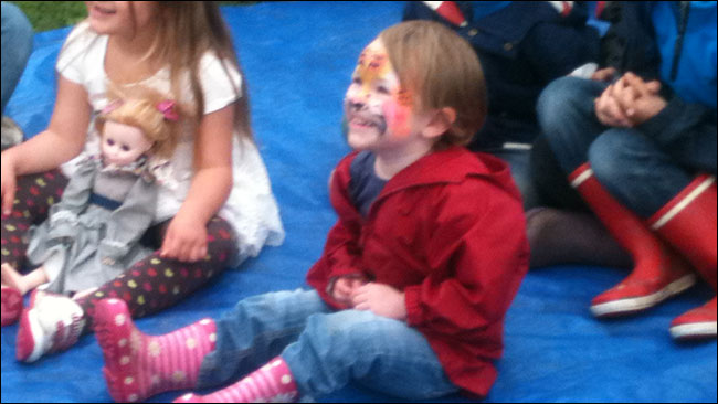 Emma watching Punch & Judy for the first time