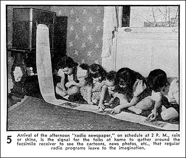 A newspaper radio facsimilie being read by a group of children