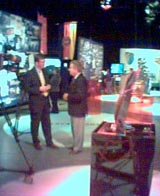 Nick Higham does a piece to camera with Richard Baker in the News 50 exhibition