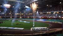 Fireworks as a ridiculous limo brings the riders onto the track