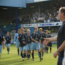 A victorious Leeds United team leaves the QPR pitch