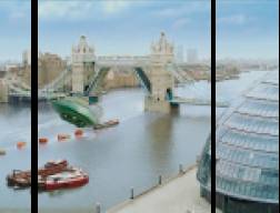 A very bad still of Thunderbird 2 approaching Tower Bridge